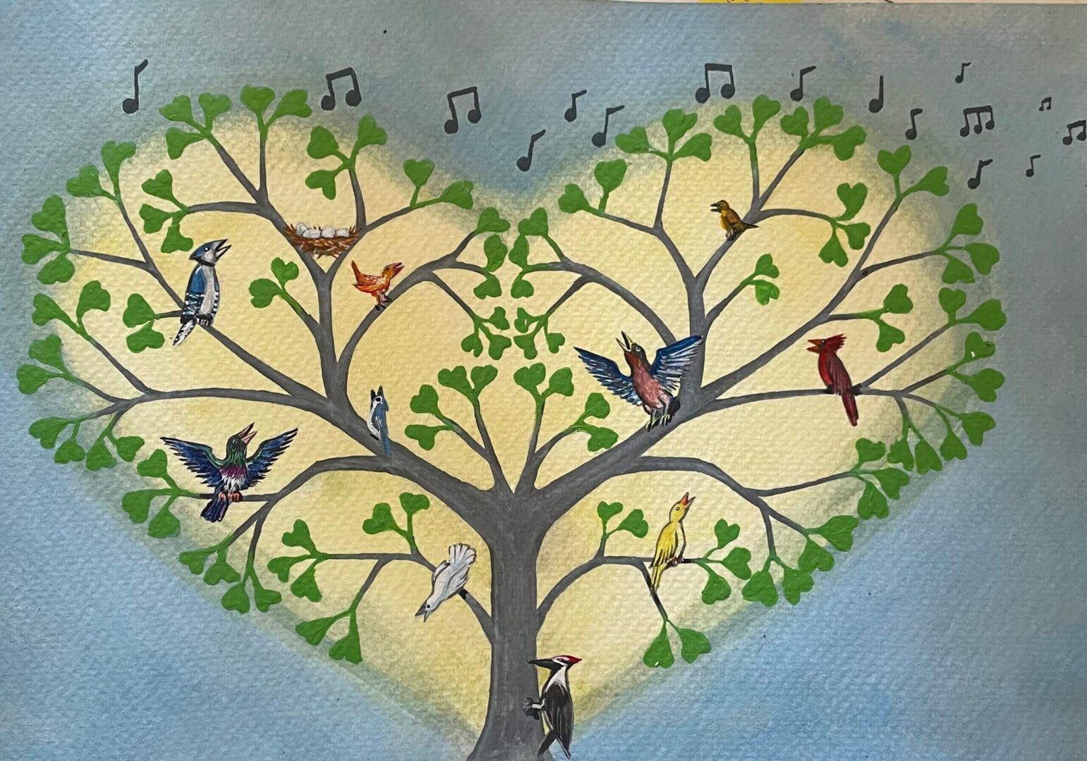 A heart-shaped tree with birds perched on its branches.